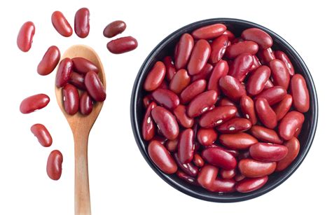 red kidney beans in a black bowl and spoon on transparent background, top view, flat lay, top ...