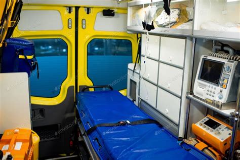 Interior of ambulance car with stretcher, refrigerator and medical equipment photo by ...