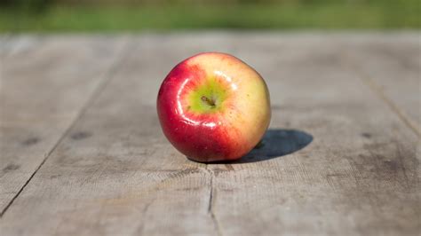 Red apple on a wooden table HD desktop wallpaper : Widescreen : High ...