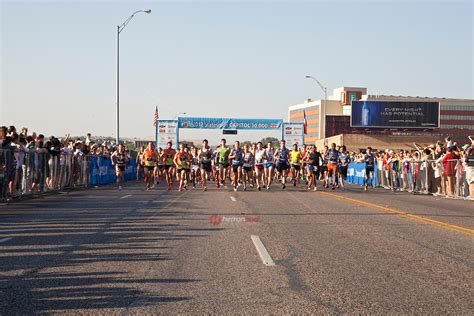 Runners at start of 10K race in downtown Austin, Texas | HerronStock.com