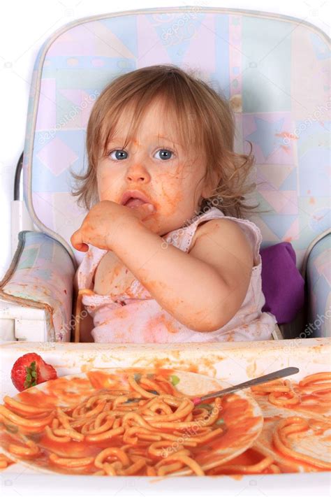 Messy baby girl eating spaghetti — Stock Photo © gvictoria #3646430