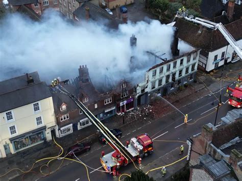 Aerial footage shows aftermath of Midhurst fire which saw flames rip through Angel Inn hotel ...