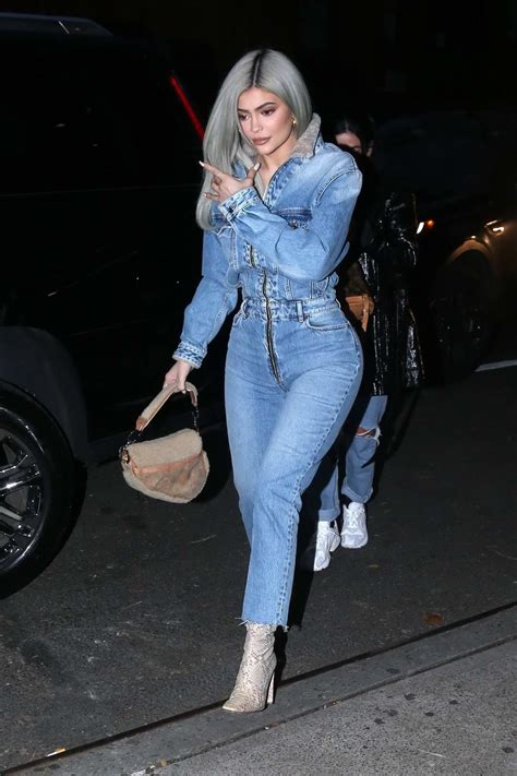 Kylie Jenner rocks denim jumpsuit with snakeskin boots for her pop up shop event at Dover Street ...