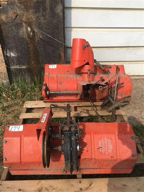 2 Simplicity garden tractor attachments: Rototiller & snow blower plus grain bin dolly