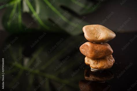 Zen concept: stones arranged against black background Stock Photo ...