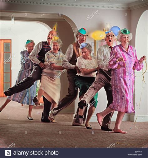 A group of old age pensioners dancing the conga Stock Photo: 25333298 - Alamy