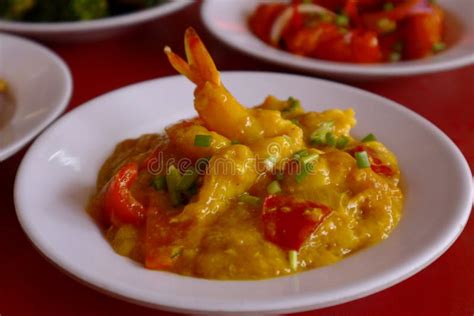 Cooked and Buttered Corn on the Cob on a Gray Dish, Womanâ€™s Hand ...