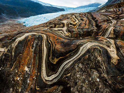 Near the edge of Engabreen glacier, the contortions of time are visible in the sinuous infolding ...