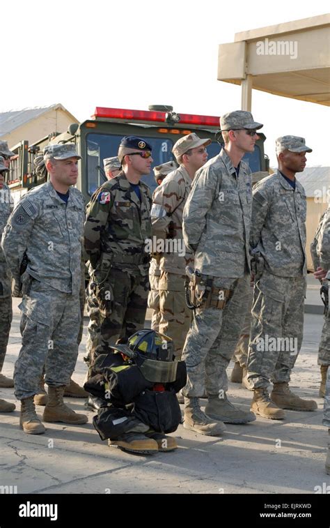 An empty firefighter’s uniform and equipment amid a formation of joint ...