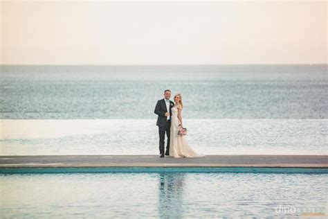 newlyweds in front of ocean and pool Riu Santa Fe, Los Cabos, Mexico ...