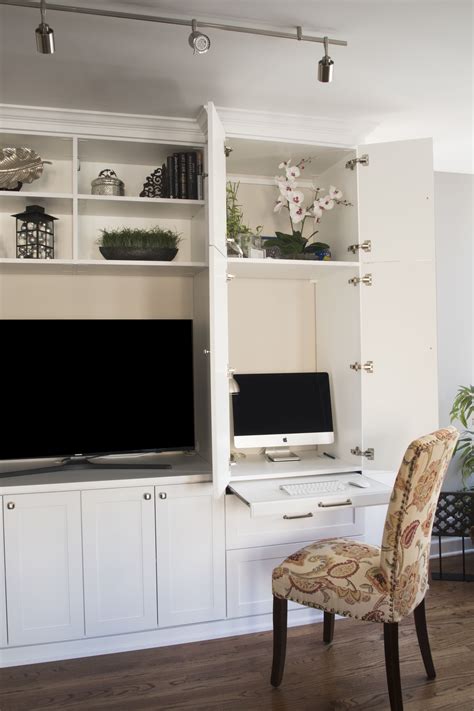 Work right from your living room with a custom pull-out shelf and space for your desktop ...