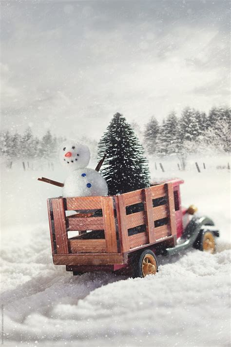 "Small Toy Truck With Trees And Snowman In Snow Storm" by Stocksy ...