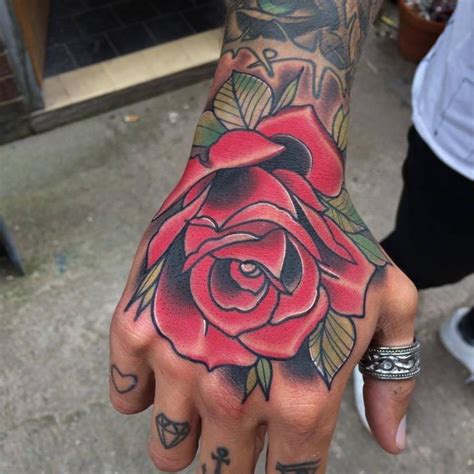 Red Rose Tattoo On Right Hand | Hand tattoos for guys, Tattoos, Rose hand tattoo