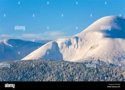 Snowy sunrise mountain landscape Stock Photo - Alamy