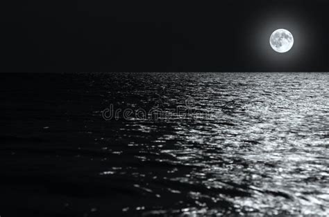 Moonlight on the Waves at Night in the Sea on Long Exposures Stock ...