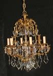 Antique cast bronze and crystal six arm chandelier