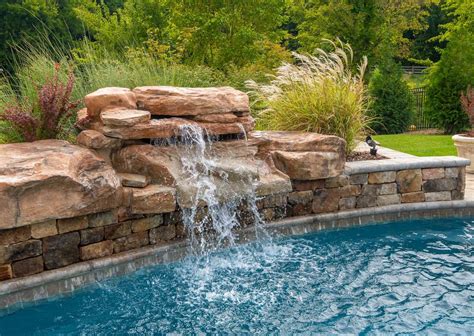 Enhance Your Backyard Pool with a Water Feature - AVIVA POOLS