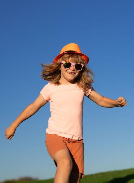 Premium Photo | Kid boy running outdoor sport for children runner kids race in park