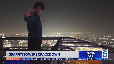 BASE jumper leaps from graffitied towers in downtown L.A. - YouTube