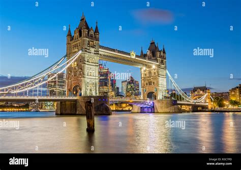 The Tower Bridge in London lights up in the Evening Stock Photo - Alamy