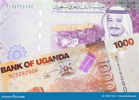 Ugandan Currency Paired with Money from Saudi Arabia Stock Image ...