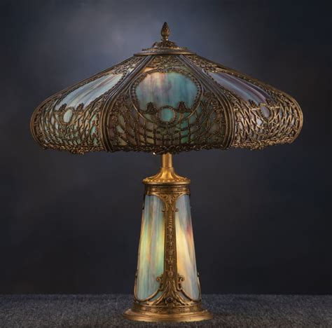 A beautiful antique curved glass, stained glass Table Lamp, circa 1920-1925, attributed to The ...