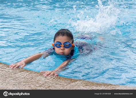 Young Boy Swimming Pool Stock Photo by ©zenstock 201981626