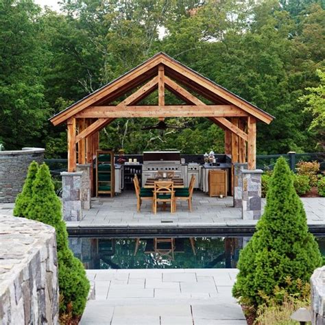 A Post and Beam Pavilion With Outdoor Kitchen