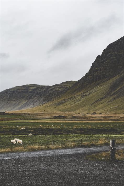 Green Mountains Across Dark Sky · Free Stock Photo