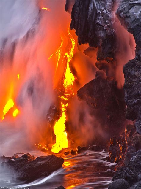 Fire and lava spew from Hawaiian volcano in extraordinary images that ...