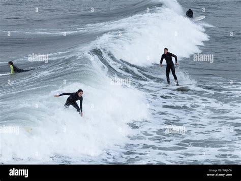 Surfers surfing at Saltburn by the sea, North Yorkshire, England. UK ...