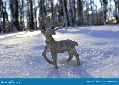 A Beautiful Wooden Christmas Deer is Standing in the Snow. Stock Photo ...