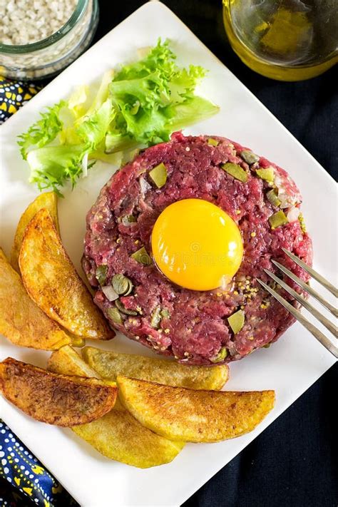 Raw Beef Steak Tartare with French Fries Stock Photo - Image of patty ...