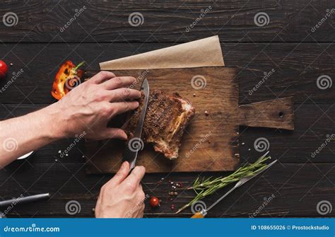 Cutting of Grilled Meat on Rustic Wooden Table Stock Photo - Image of ...