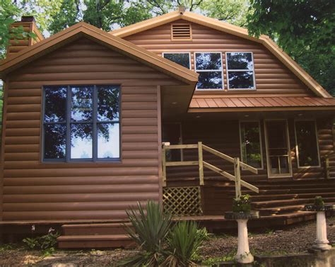 This brown steel siding has the look of genuine wood. You get the appeal of a log home without ...