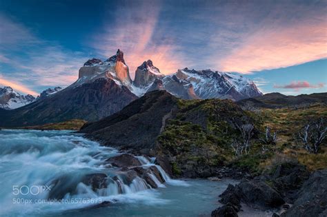 Sunrise over the Salto Grande cascades, with the Cuernos del Paine mountains - in Torres del ...