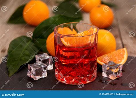 A Glass of Negroni Cocktail with Campari, Vermouth, Gin and Oranges. Stock Image - Image of ...