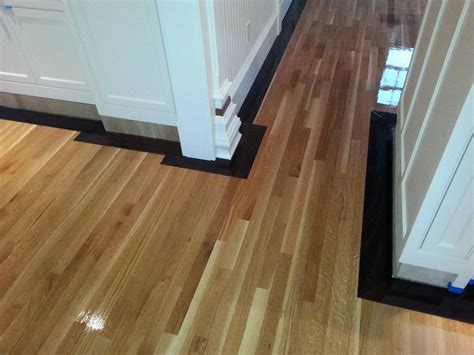 Rift Sawn White Oak Flooring with 5" Walnut Border in Marlboro, MA | Central Mass Hardwood Inc.