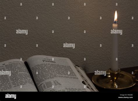 Open bible and candle hi-res stock photography and images - Alamy