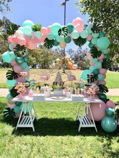 mint green and pink balloons, palm leaves, pink flamingos, cupcake stands, … | Outdoor birthday ...