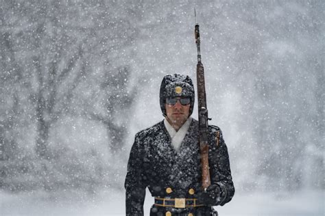 Guards at the Tomb of the Unknown Soldier kept watch during rare blizzard