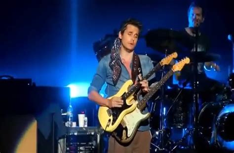 John Mayer takes guitar from fan mid-solo and finishes with it.