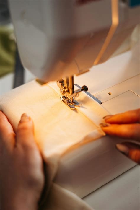 Person Sewing a Fabric · Free Stock Photo