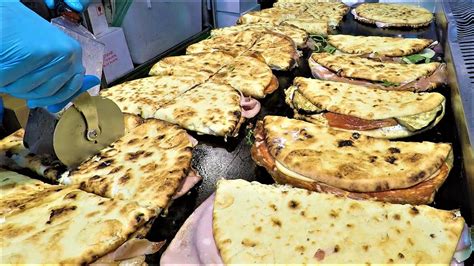 Italy Street Food. Large Flat Bread 'Spianata' Stuffed with Ham, Salami, Cheese and more - YouTube