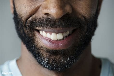 Download premium image of Closeup of smiling teeth of a black man ...