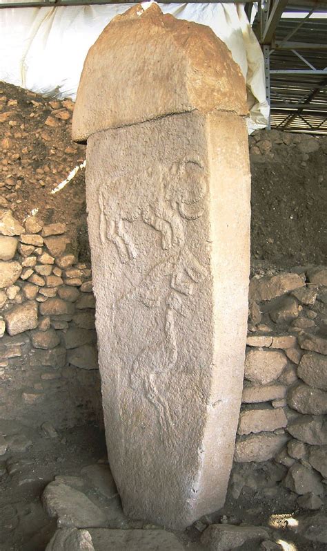 Gobekli Tepe... top-eroded monolith and carved bull (with sun-disk?), alligator (or fox?), and a ...