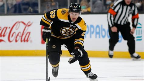 Brad Marchand leaves game with upper body injury after a 'cheap' hit