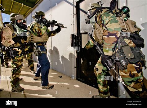 FBI SWAT team practices breaching a room at a "Live Fire Kill House" tactical training facility ...