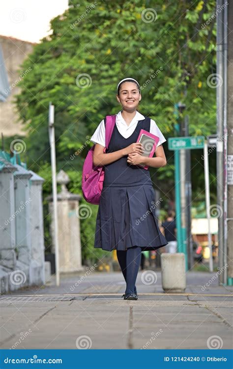 Female Student Wearing Uniform Walking on Sidewalk Stock Photo - Image of student, uniform ...