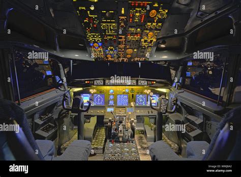 Cockpit of a Boeing 737 - 700, center console with gas levers of the ...